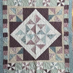 Handmade patchwork quilt with a garden theme
